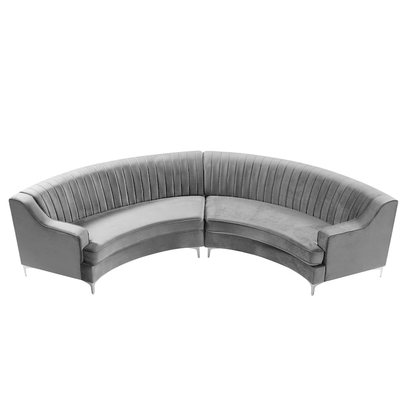 Pikowana aksamitna sofa w kształcie łuku z poduszkami