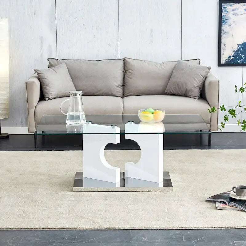 A rectangular modern and fashionable coffee table with tempered glass tabletop and white MDF legs